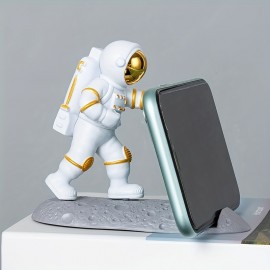 Spice Up Your Desk with this Astronaut-Themed Phone Holder - Perfect for Office Decor!