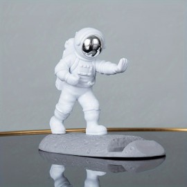 Spice Up Your Desk with this Astronaut-Themed Phone Holder - Perfect for Office Decor!