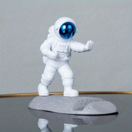 Spice Up Your Desk with this Astronaut-Themed Phone Holder - Perfect for Office Decor!