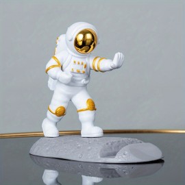 Spice Up Your Desk with this Astronaut-Themed Phone Holder - Perfect for Office Decor!